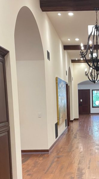 Hallway with wood beams and wide-plank floor — Thousand Oaks, 2026