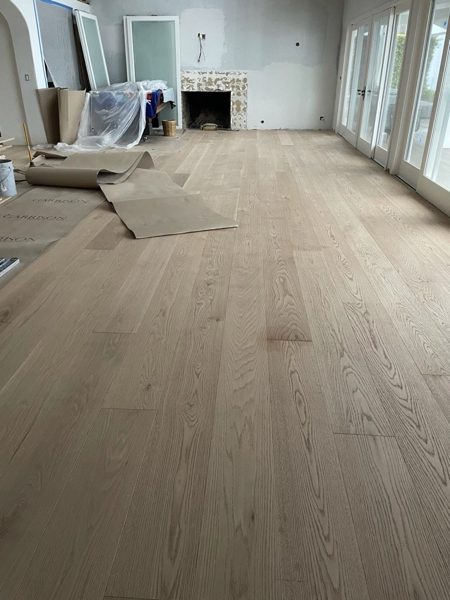 Oak floor installation in progress — Malibu, 2021