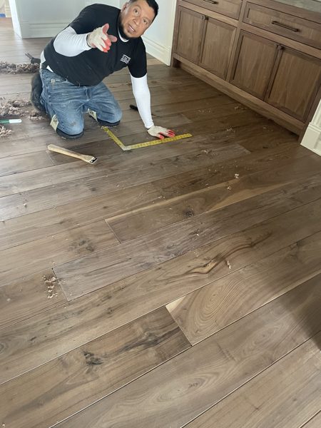 Laying out wide planks during install — Pacific Palisades, 2025